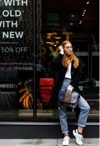 Lady standing in front of the store