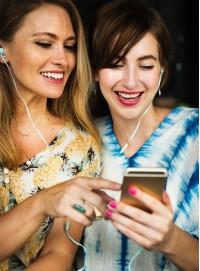 Two laddies using cell phone
