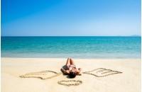 girl with angel wings on the beach