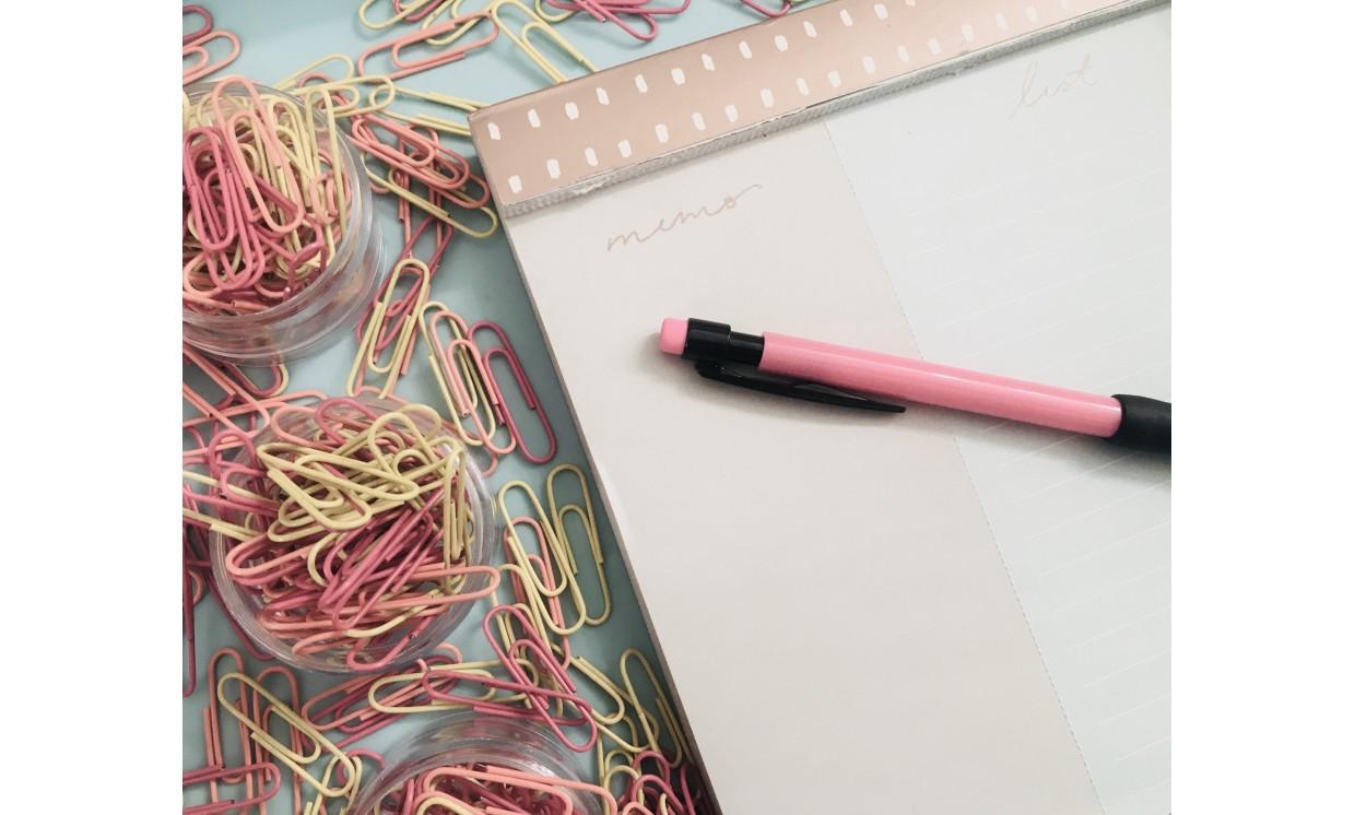 abstract pink yellow office planning pastel desk overhead top view paperclips flatlay